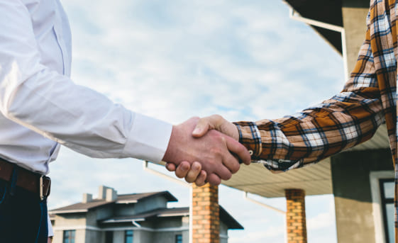 Image of a two man shaking their hands