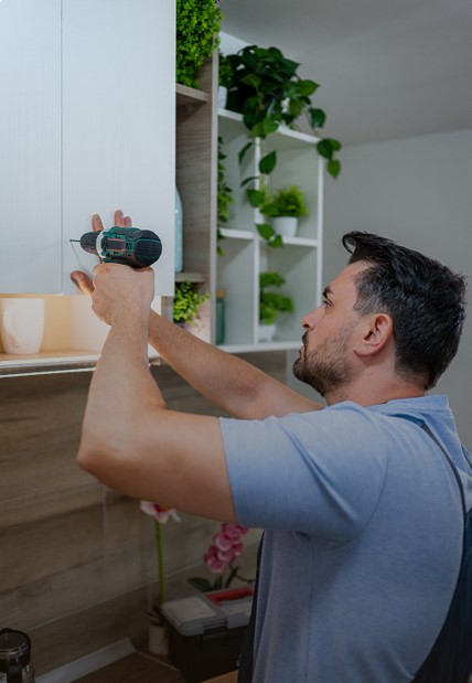 Image of a man working on a kitchen