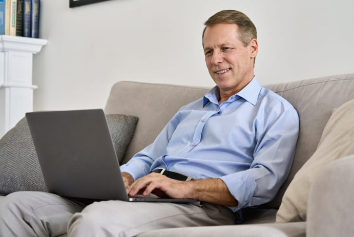 Image of a man using his notebook